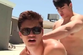 A poolside gay romp unfolds as the hunky jock rides his petite Asian boyfriend. He eagerly services him, then mounts him, culminating in a poolside climax. Indulge in this steamy, HD gay-for-pay adventure.
