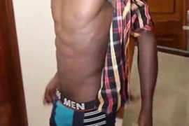 Young black twink George flaunts his big cock, stroking it with rhythm and passion. His moans fill the room as he reaches climax, leaving him breathless and satisfied.