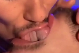 Two gay men tongue and spit kissing (lots of tongue)